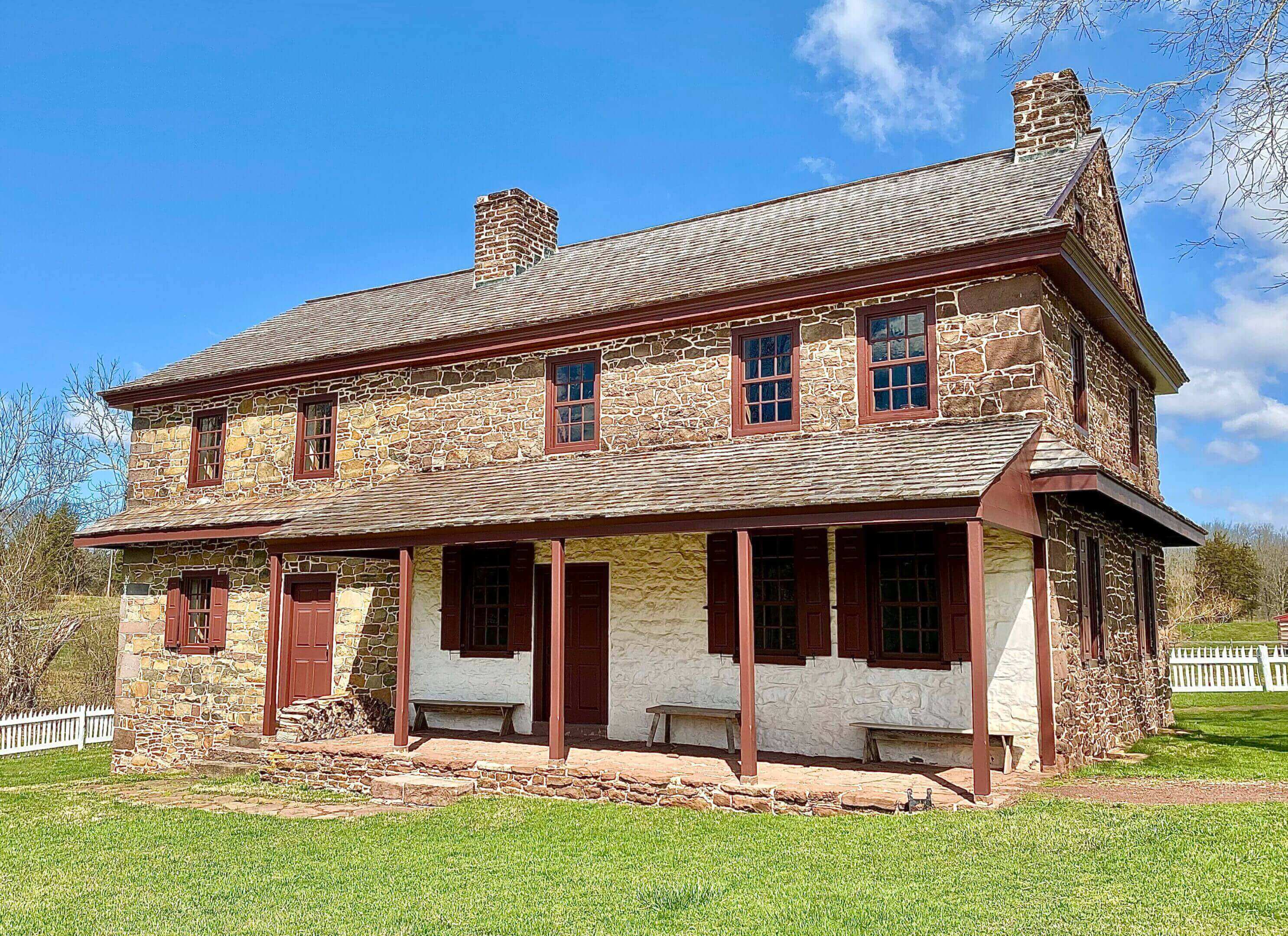 Historic stone farmhouse with covered porch